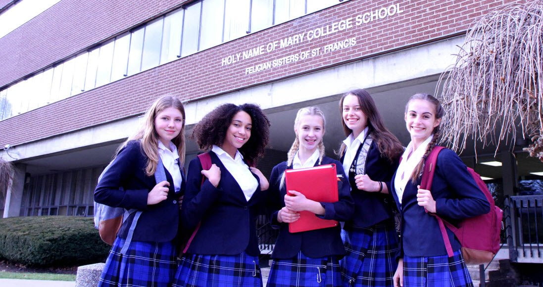 Senior student outside the entrance to Holy Name of Mary College School